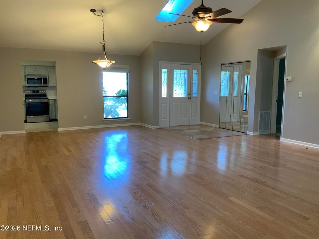 Empty room, Interior, Kitchen, Pendant Lights, Stainless Steel Appliances, Wood Texture Flooring