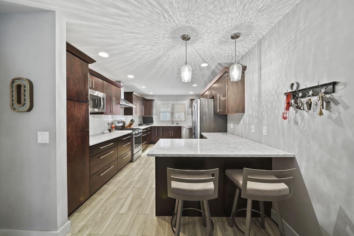 Interior, Kitchen, Pendant Lights, Recessed Lighting, Stainless Steel Appliances, Wood Texture Flooring