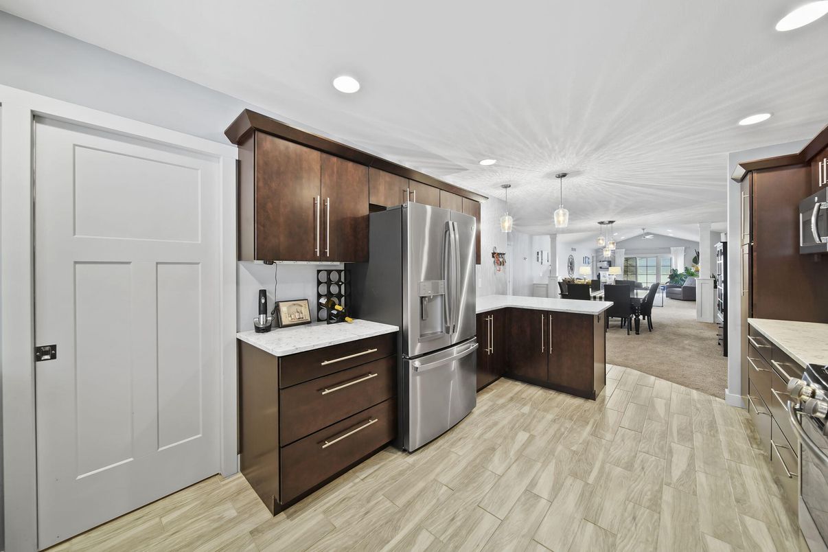Dining room, Interior, Kitchen, Pendant Lights, Recessed Lighting, Stainless Steel Appliances, Wood Texture Flooring