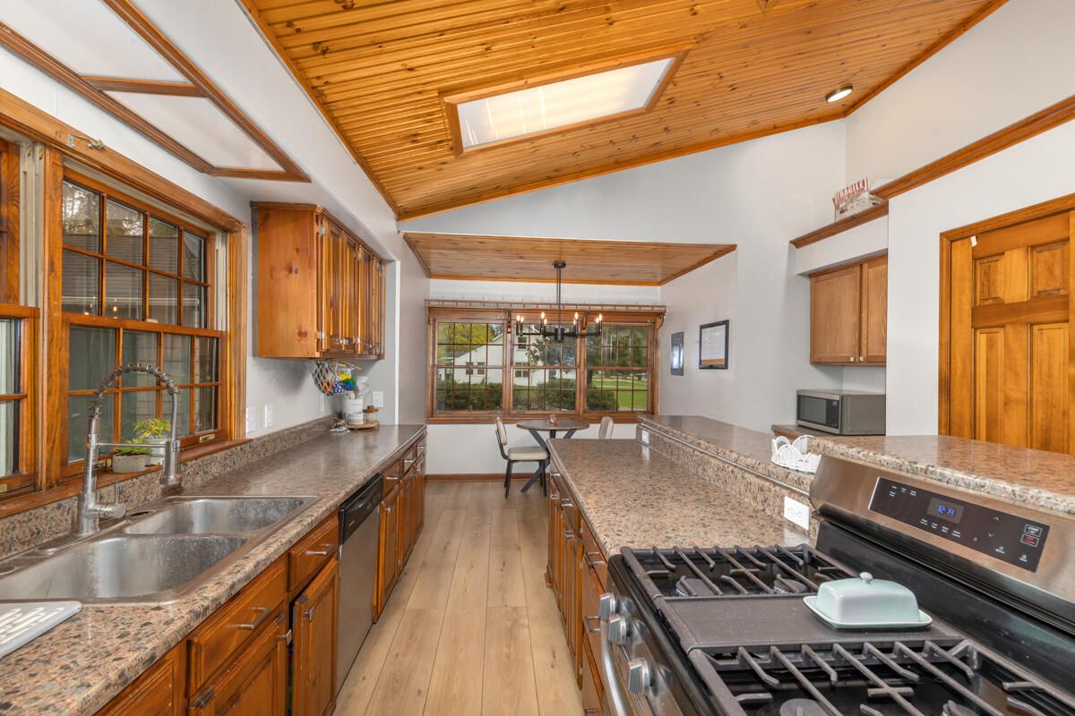 Chandelier, Dining room, Interior, Kitchen, Pendant Lights, Recessed Lighting, Wooden Beams, Wooden Ceilings, Wood Texture Flooring