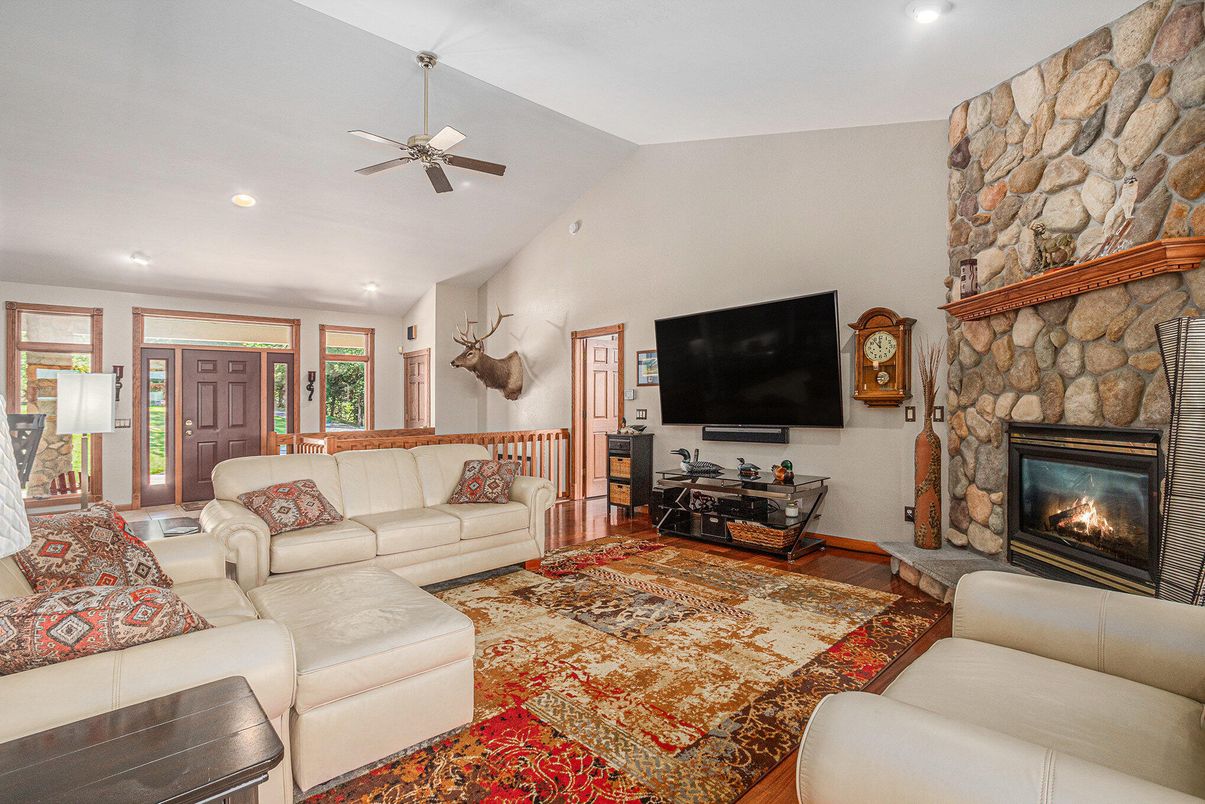 Fireplace, Interior, Living room, Recessed Lighting, Stone Walls, Wood Texture Flooring