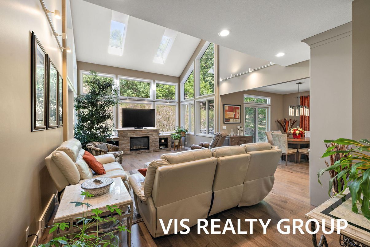 Dining room, Fireplace, Interior, Living room, Pendant Lights, Recessed Lighting, Wood Texture Flooring