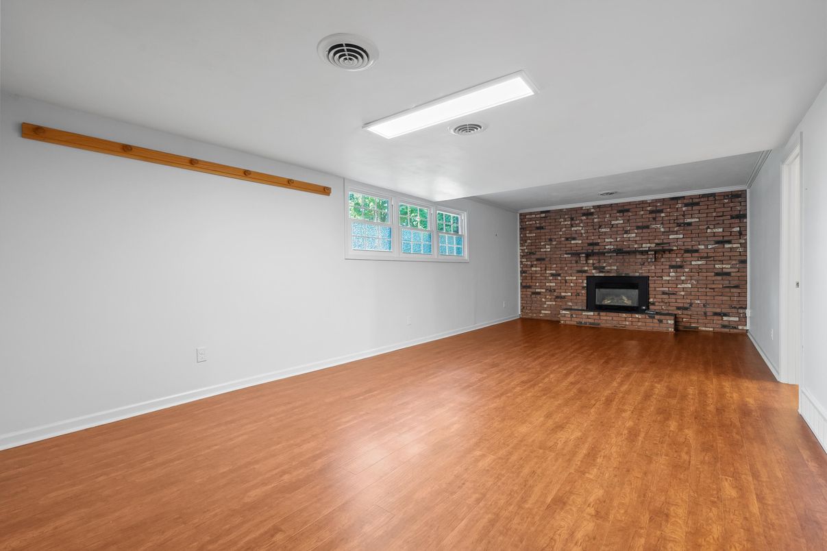 Empty room, Fireplace, Interior, Recessed Lighting, Stone Walls, Wood Texture Flooring
