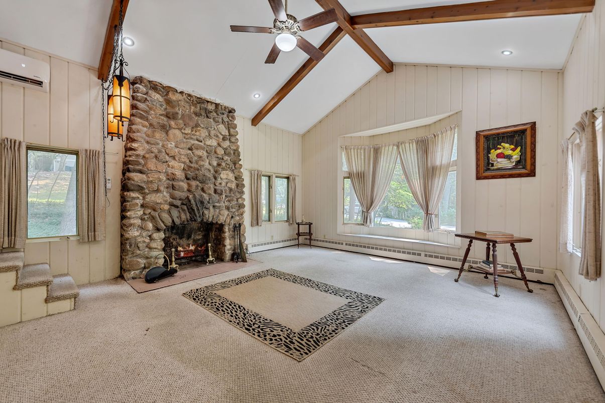 Empty room, Fireplace, Interior, Recessed Lighting, Stone Walls, Wooden Beams
