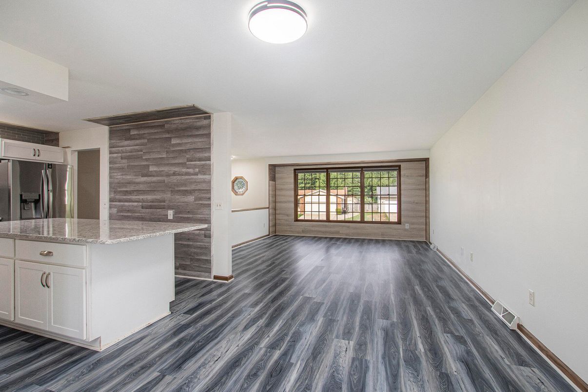 Empty room, Interior, Kitchen, Stainless Steel Appliances, Wood Texture Flooring, Wooden Walls