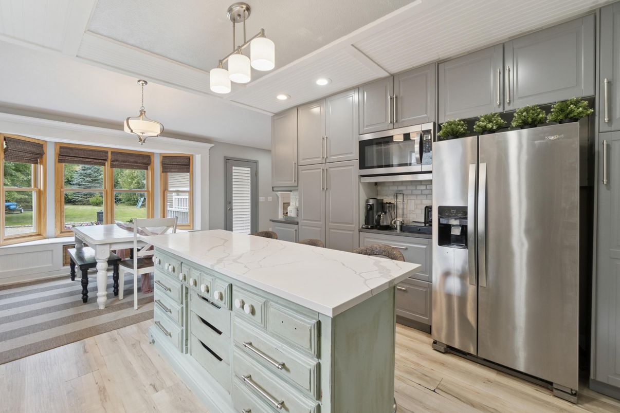 Dining room, Interior, Kitchen, Pendant Lights, Recessed Lighting, Stainless Steel Appliances, Wood Texture Flooring
