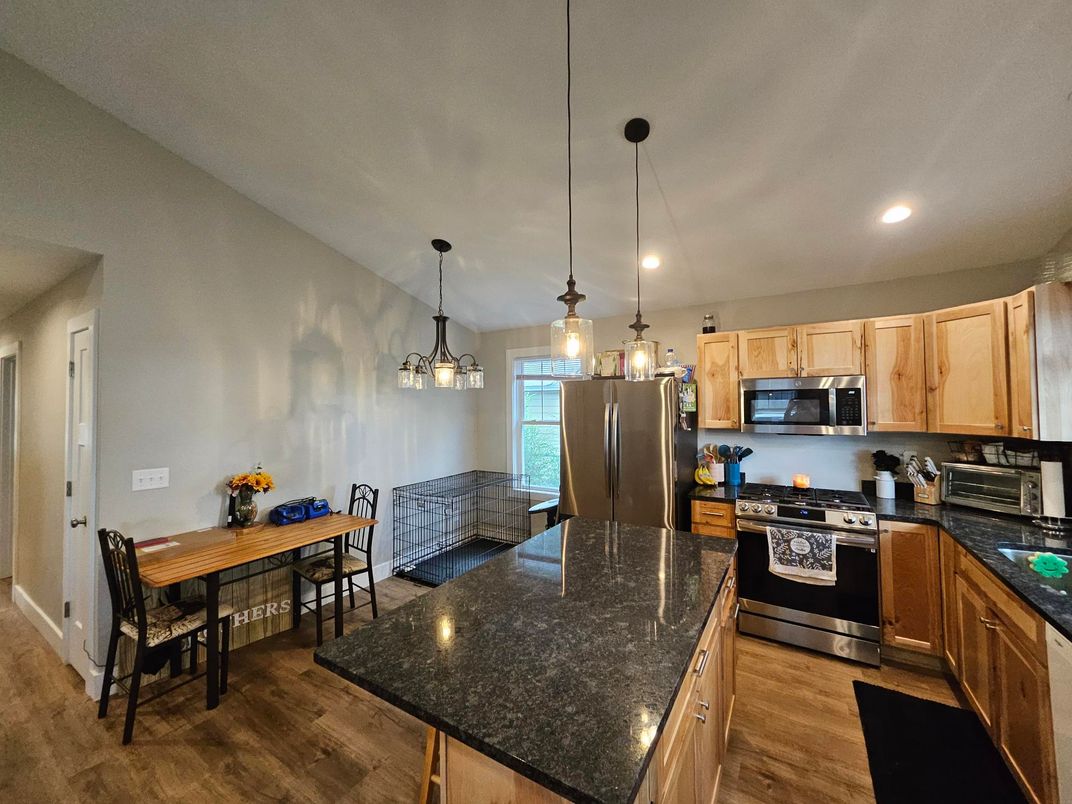 Dining room, Interior, Kitchen, Pendant Lights, Recessed Lighting, Stainless Steel Appliances, Wood Texture Flooring