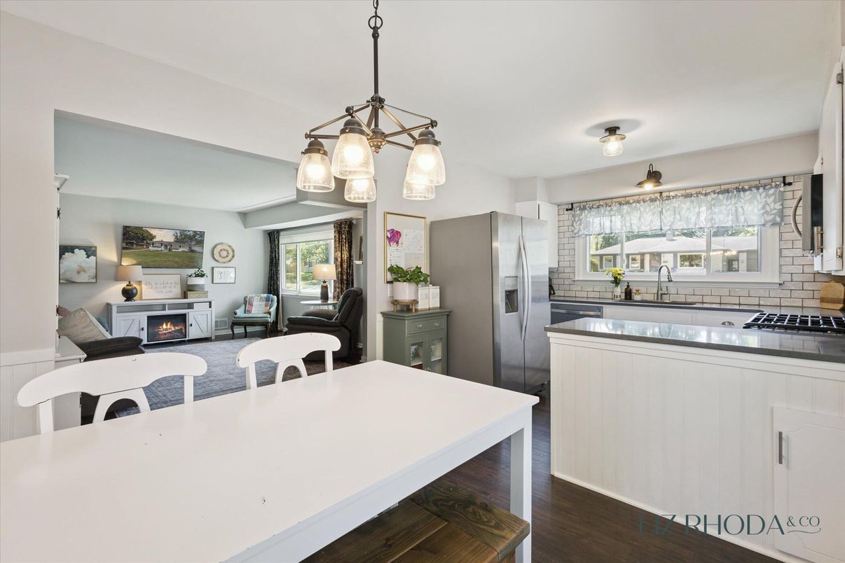 Fireplace, Interior, Kitchen, Living room, Pendant Lights, Stainless Steel Appliances, Wood Texture Flooring