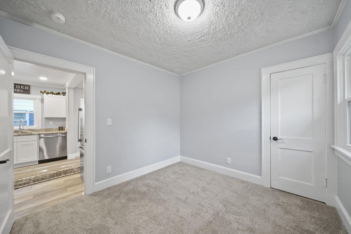 Empty room, Interior, Kitchen, Recessed Lighting, Stainless Steel Appliances, Wood Texture Flooring