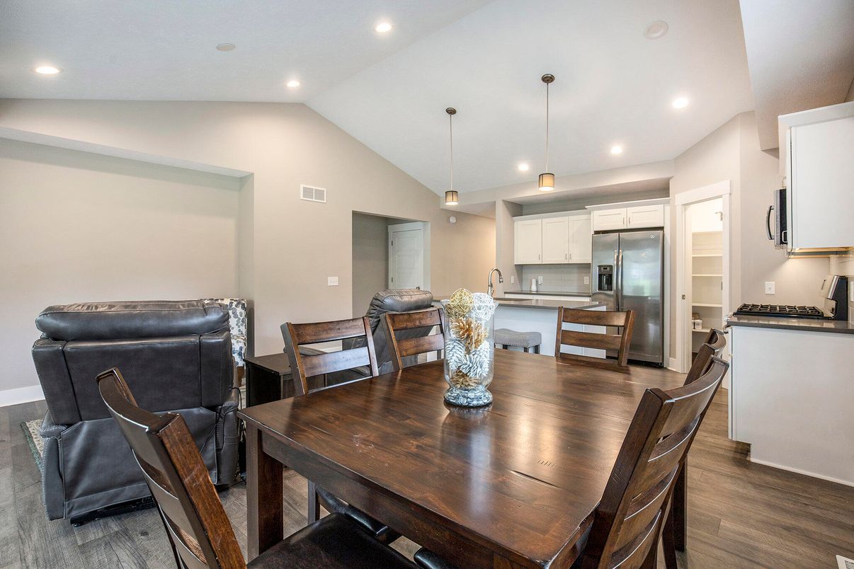 Dining room, Interior, Kitchen, Pendant Lights, Recessed Lighting, Stainless Steel Appliances, Wood Texture Flooring