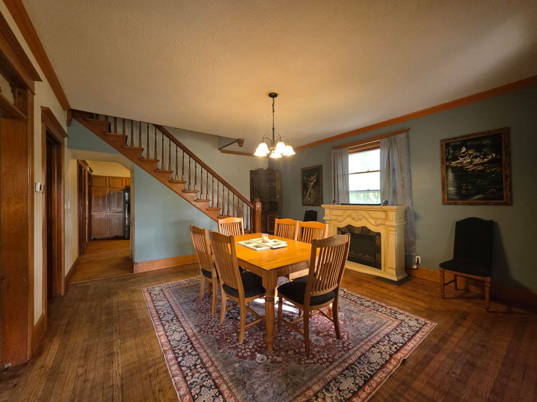 Dining room, Fireplace, Interior, Pendant Lights, Wood Texture Flooring