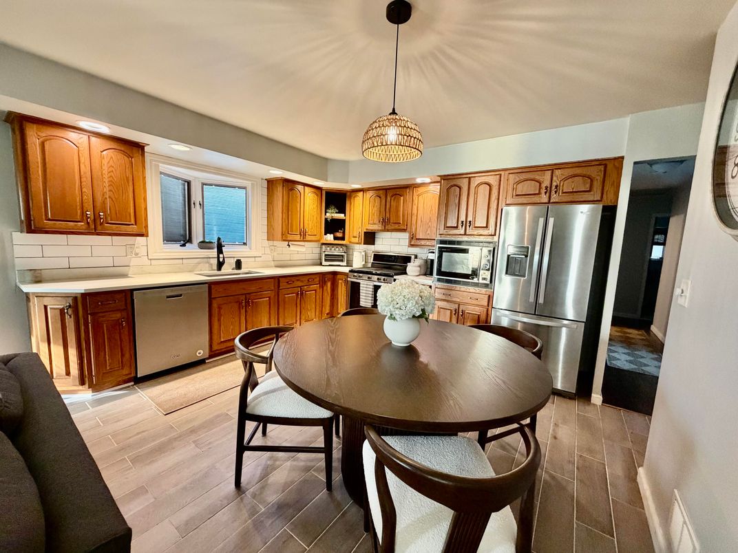 Dining room, Interior, Kitchen, Pendant Lights, Stainless Steel Appliances, Wood Texture Flooring