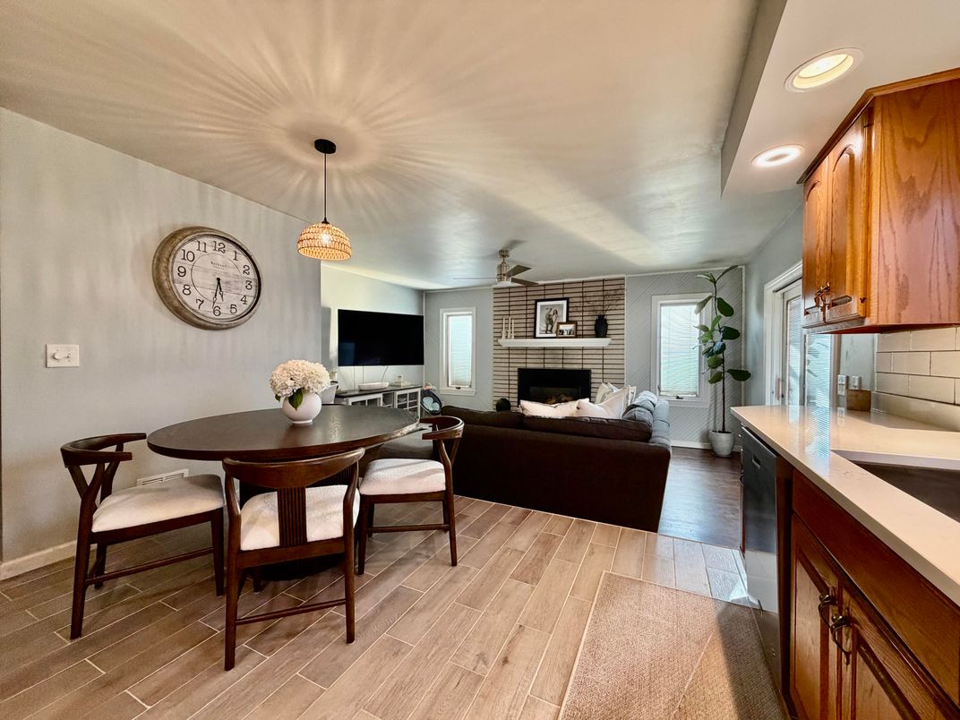 Dining room, Fireplace, Interior, Living room, Pendant Lights, Recessed Lighting, Stone Walls, Wood Texture Flooring