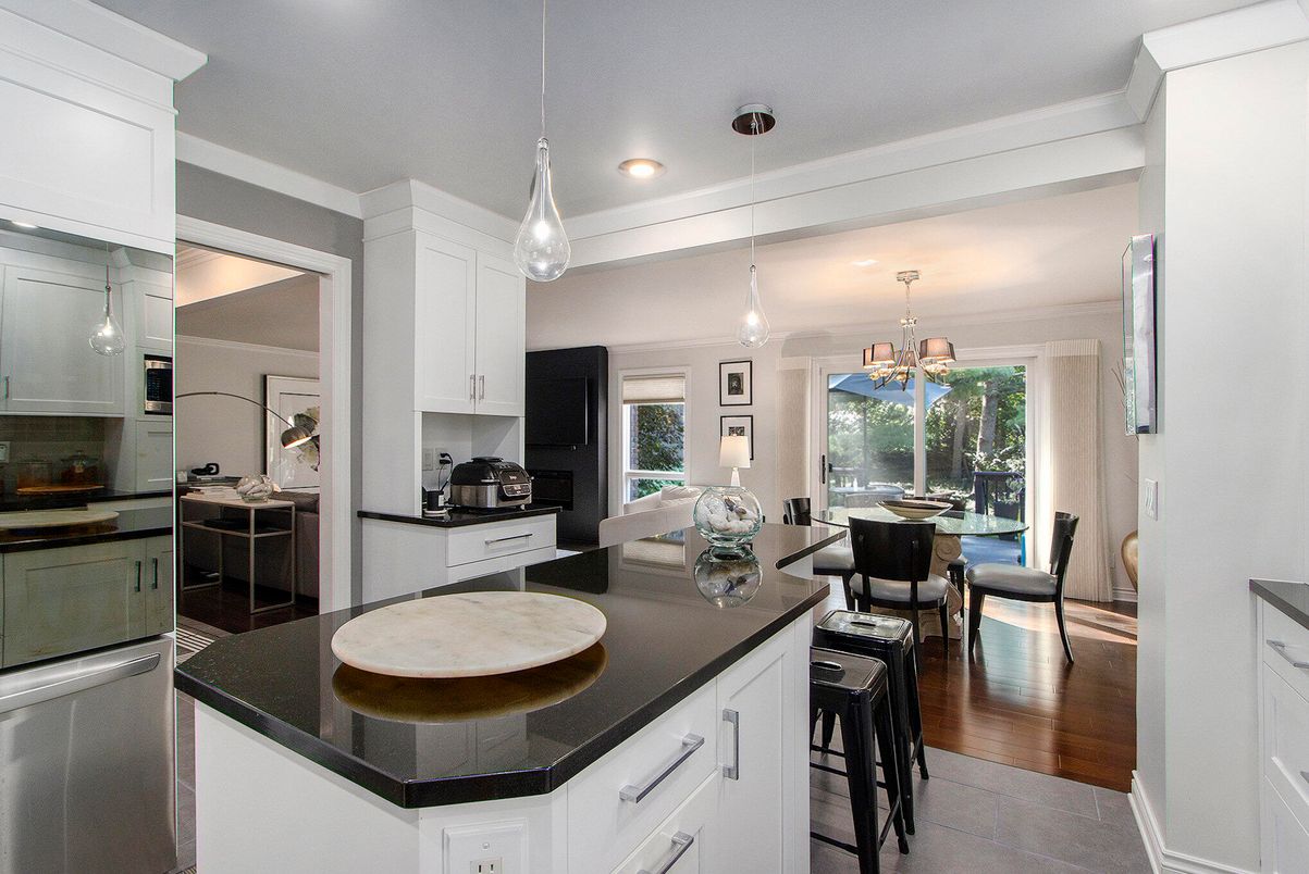 Dining room, Interior, Kitchen, Pendant Lights, Recessed Lighting, Stainless Steel Appliances, Wood Texture Flooring