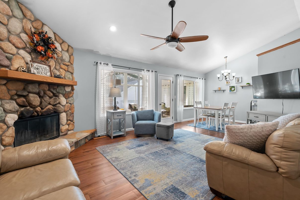 Chandelier, Dining room, Fireplace, Interior, Living room, Recessed Lighting, Stone Walls, Wood Texture Flooring