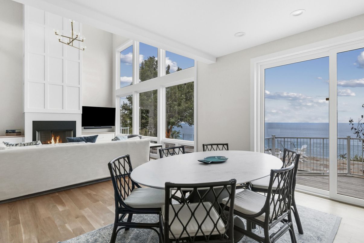 Dining room, Fireplace, Interior, Living room, Pendant Lights, Recessed Lighting, Water, Wood Texture Flooring