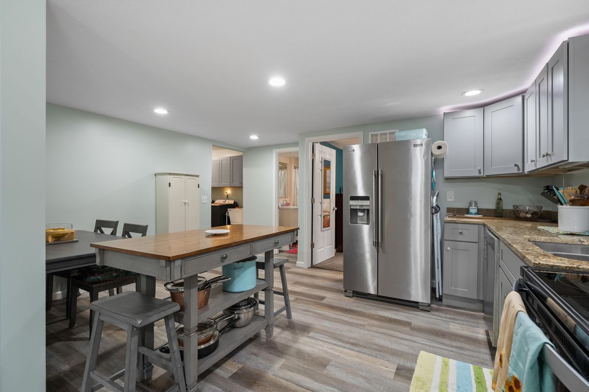 Dining room, Interior, Kitchen, Recessed Lighting, Stainless Steel Appliances, Wood Texture Flooring