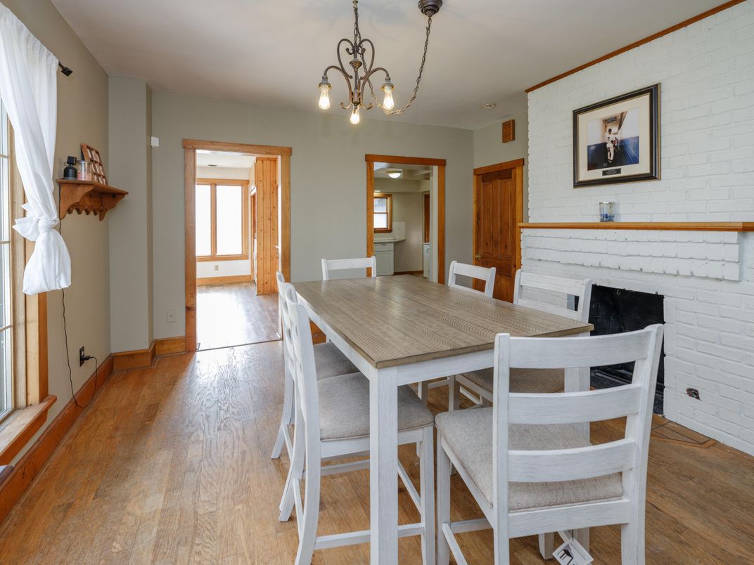 Chandelier, Dining room, Fireplace, Interior, Stone Walls, Wood Texture Flooring