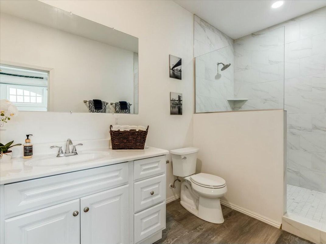Bathroom, Glass Shower, Interior, Marble Walls, Recessed Lighting, Wood Texture Flooring