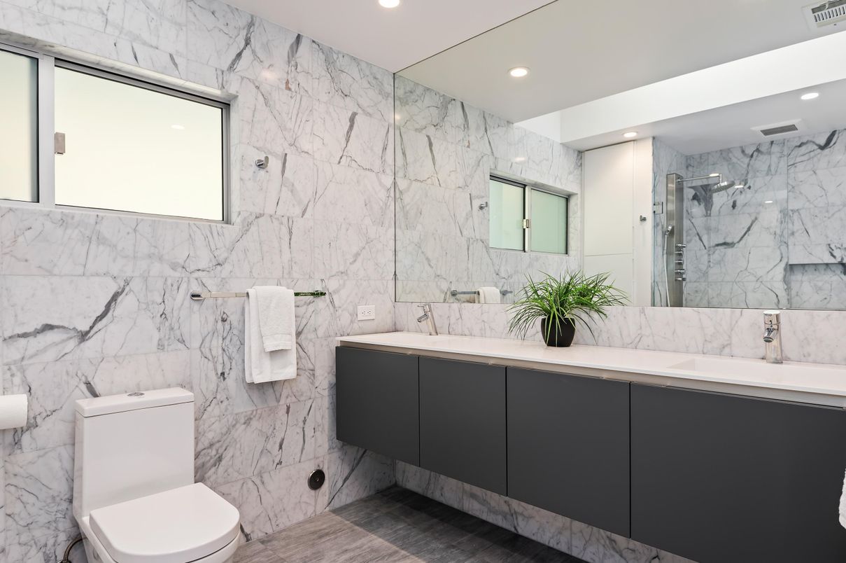 Bathroom, Dual Sink Vanities, Glass Shower, Interior, Marble, Marble Walls, Recessed Lighting