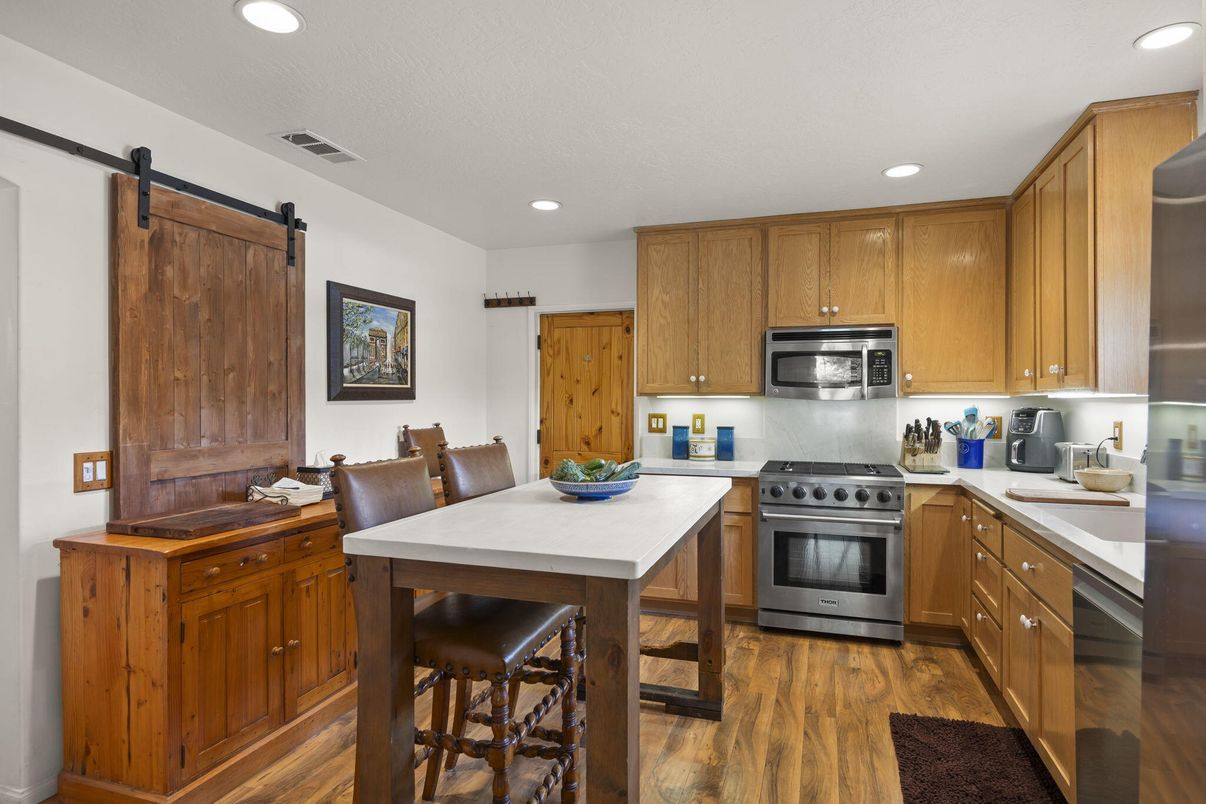 Dining room, Interior, Kitchen, Recessed Lighting, Stainless Steel Appliances, Wood Texture Flooring
