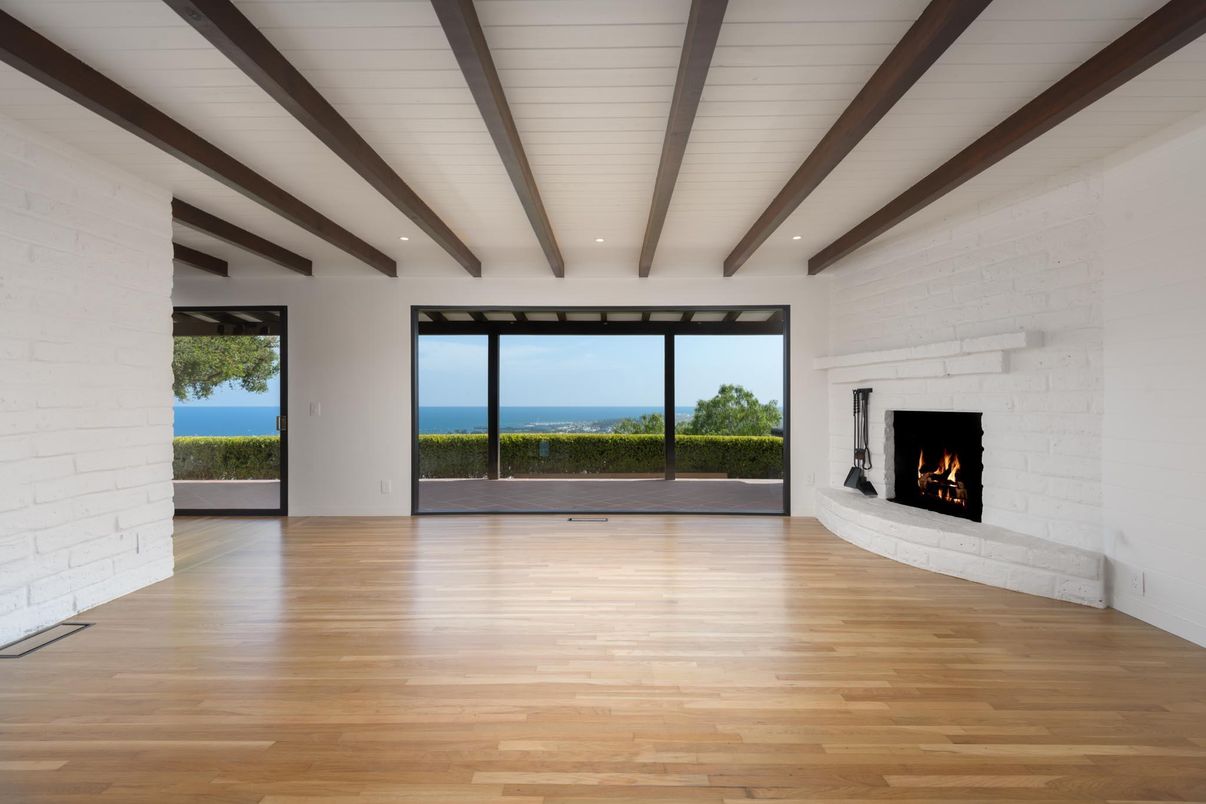 Empty room, Fireplace, Interior, Recessed Lighting, Stone Walls, Water, Wooden Beams, Wood Texture Flooring