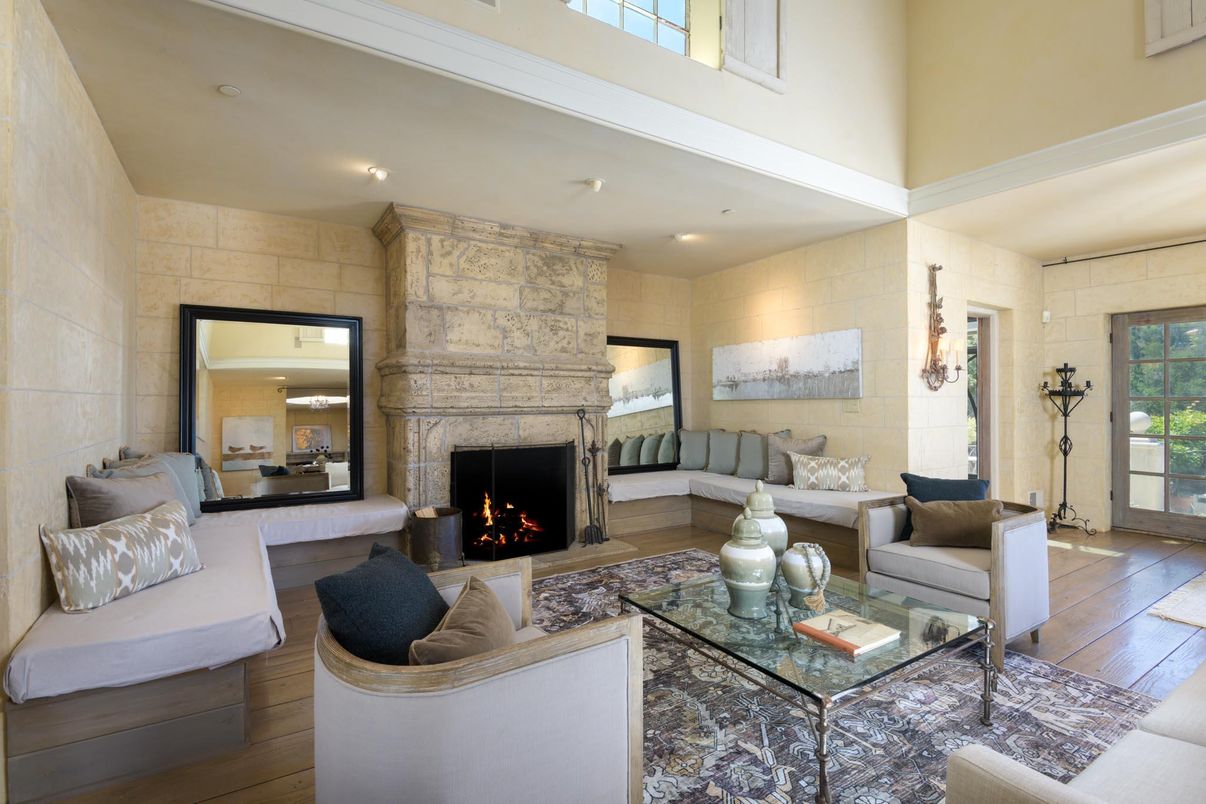 Fireplace, Interior, Living room, Recessed Lighting, Stone Walls, Wood Texture Flooring