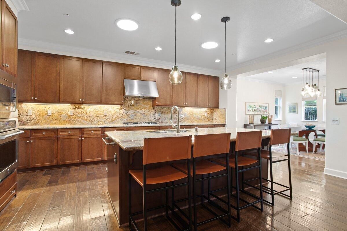 Dining room, Interior, Kitchen, Pendant Lights, Recessed Lighting, Stainless Steel Appliances, Wood Texture Flooring