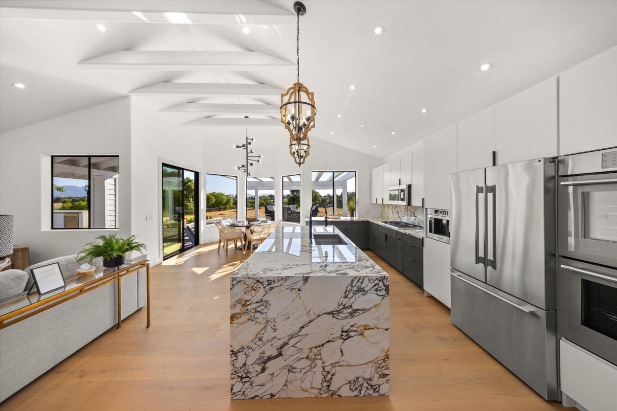 Dining room, Interior, Kitchen, Pendant Lights, Recessed Lighting, Stainless Steel Appliances, Wood Texture Flooring