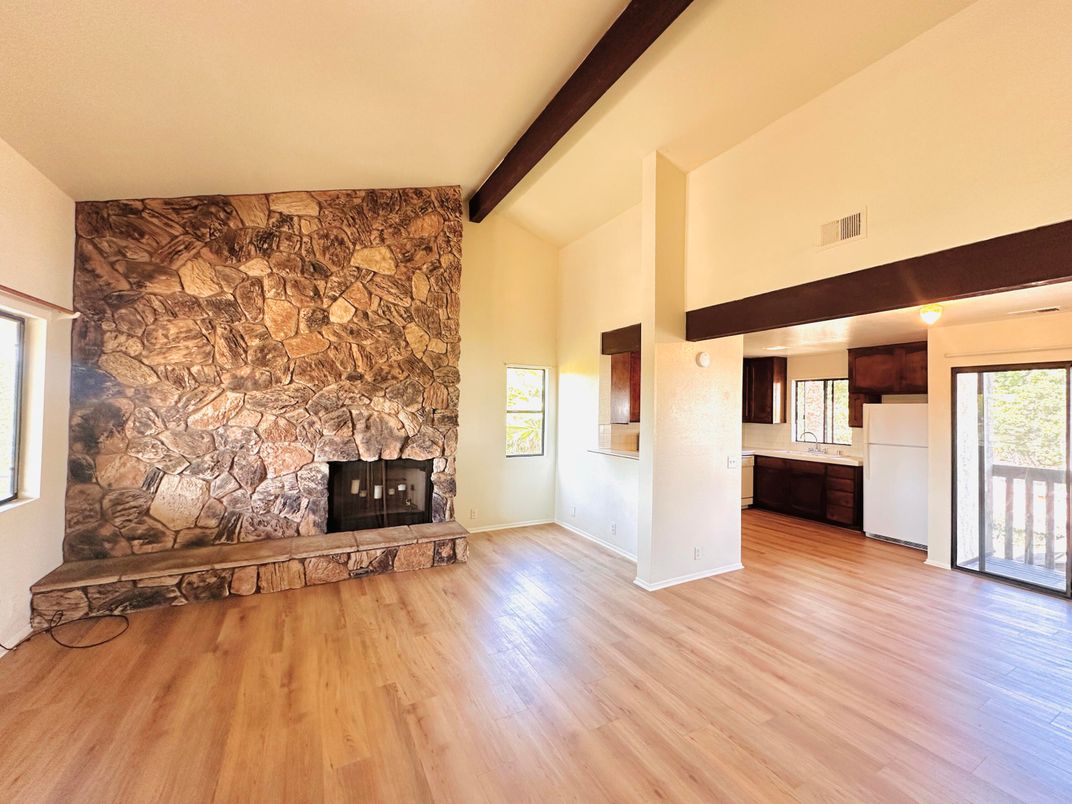 Empty room, Fireplace, Interior, Stone Walls, Wooden Beams, Wood Texture Flooring