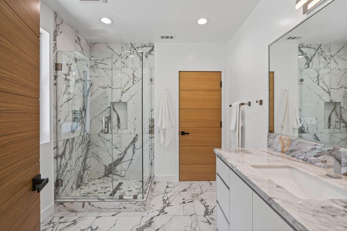 Bathroom, Dual Sink Vanities, Glass Shower, Interior, Marble, Marble Walls, Recessed Lighting