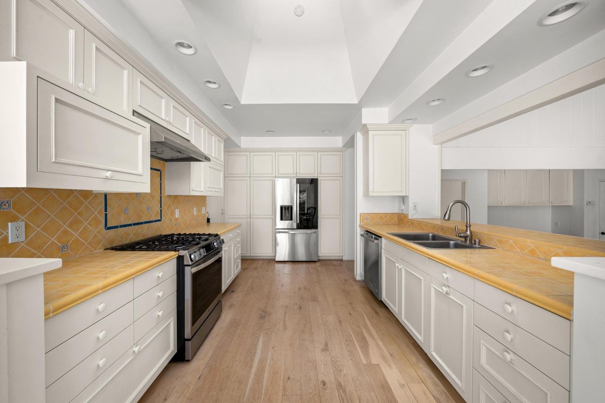 Interior, Kitchen, Recessed Lighting, Stainless Steel Appliances, Tile Countertops, Wood Texture Flooring