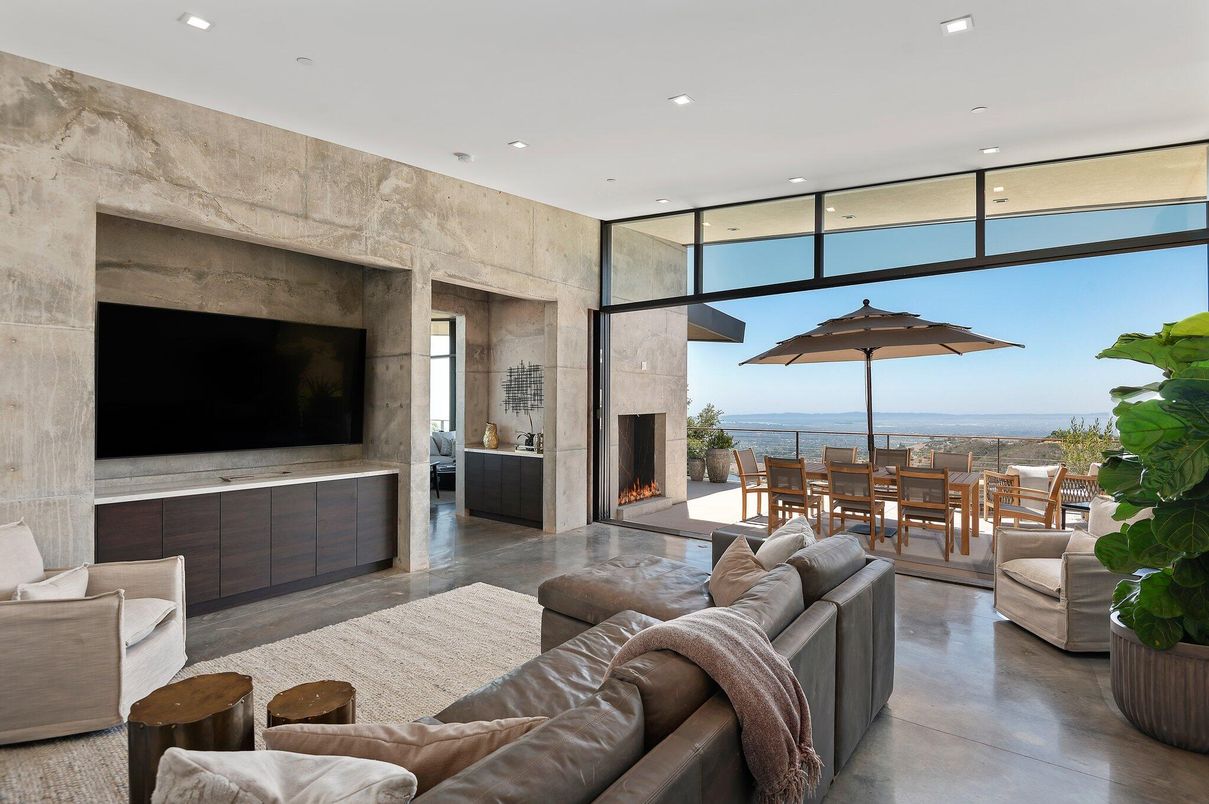 Dining room, Fireplace, Interior, Living room, Recessed Lighting, Stone Walls, Water