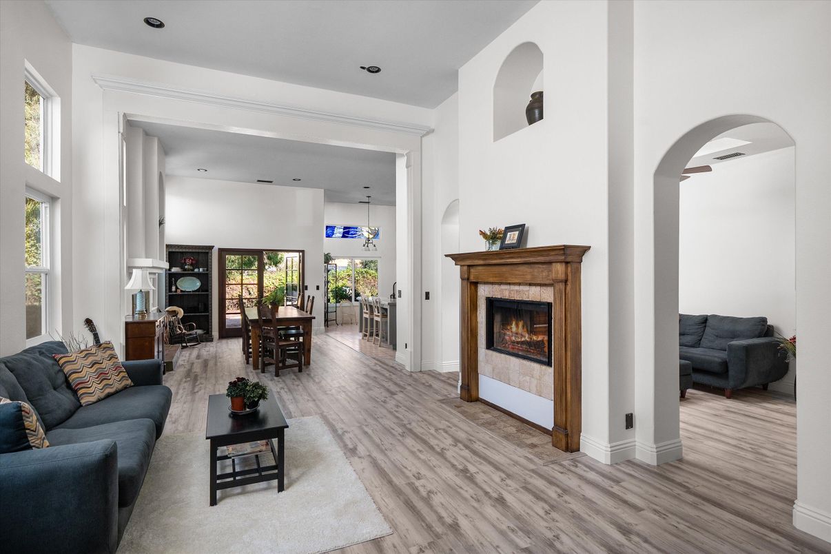 Dining room, Fireplace, Interior, Living room, Recessed Lighting, Wood Texture Flooring