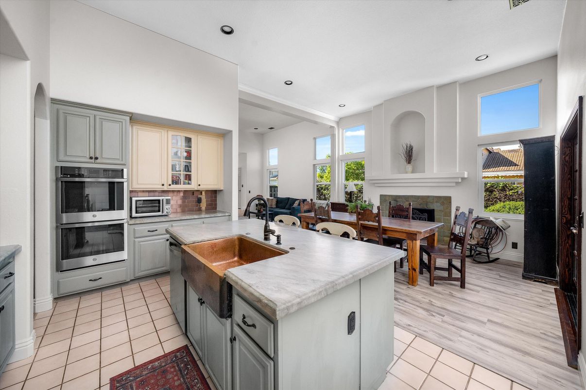 Dining room, Fireplace, Interior, Kitchen, Recessed Lighting, Stainless Steel Appliances, Wood Texture Flooring