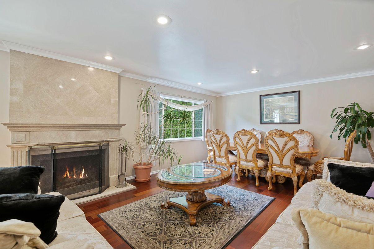 Dining room, Fireplace, Interior, Living room, Recessed Lighting, Wood Texture Flooring