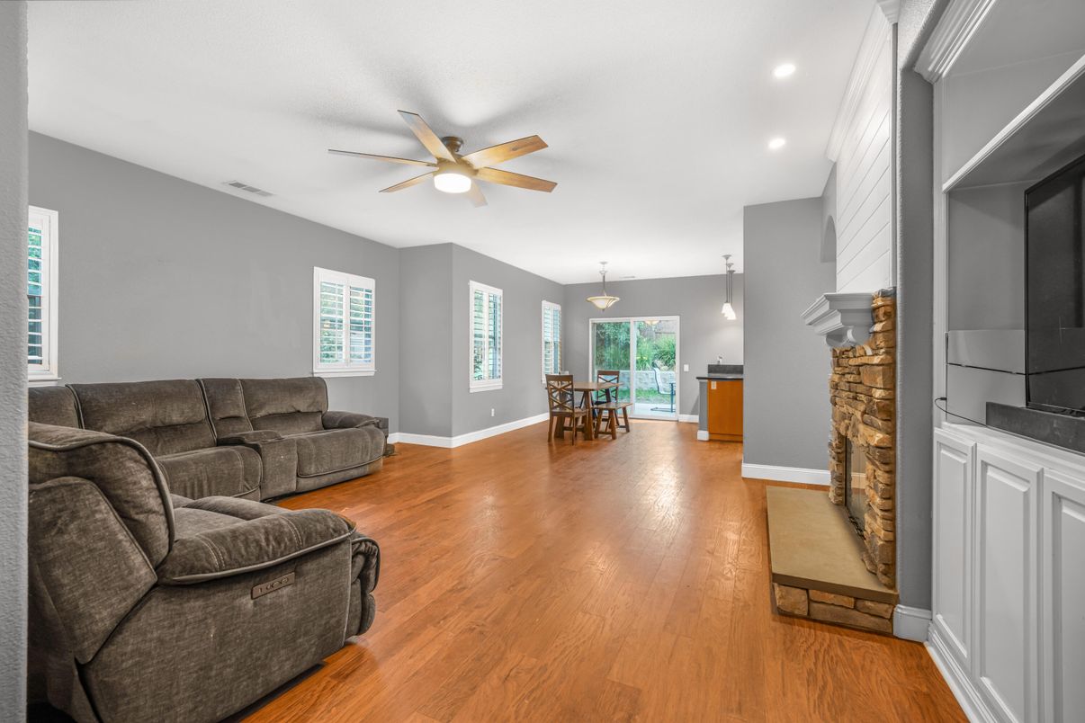 Dining room, Fireplace, Interior, Living room, Pendant Lights, Recessed Lighting, Wood Texture Flooring