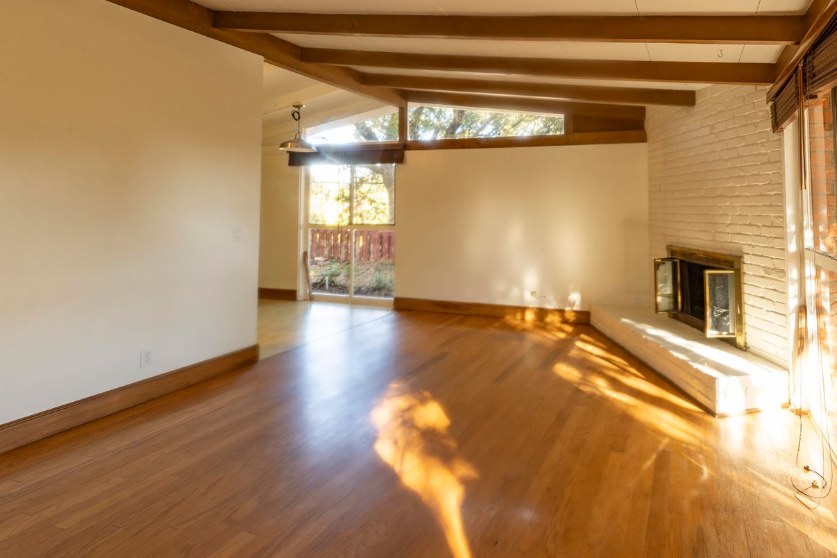 Empty room, Fireplace, Interior, Stone Walls, Wooden Beams, Wood Texture Flooring