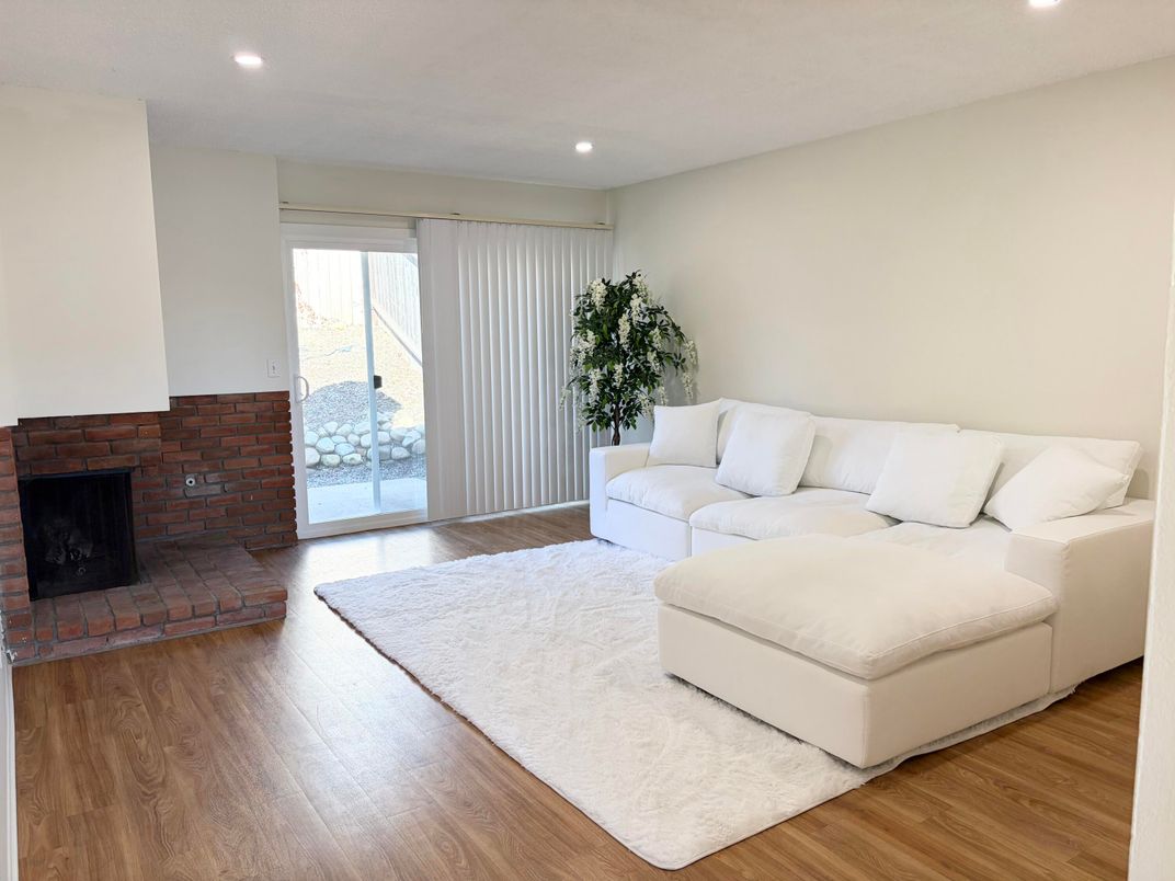 Fireplace, Interior, Living room, Recessed Lighting, Stone Walls, Wood Texture Flooring