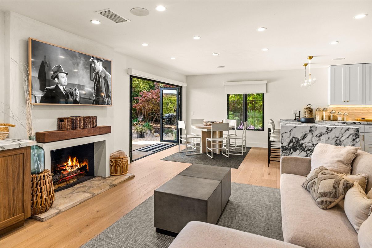 Dining room, Fireplace, Interior, Living room, Pendant Lights, Recessed Lighting, Wood Texture Flooring