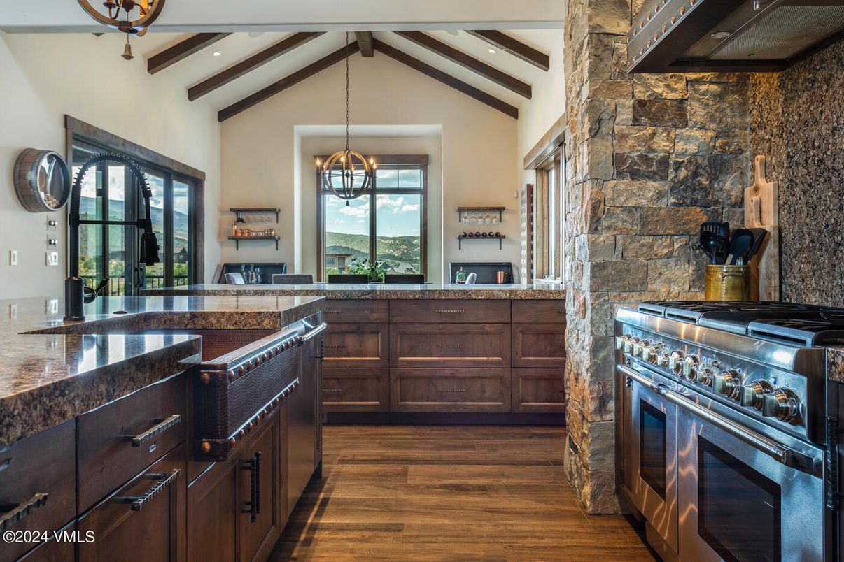 Interior, Kitchen, Pendant Lights, Recessed Lighting, Stainless Steel Appliances, Stone Walls, Wooden Beams, Wood Texture Flooring
