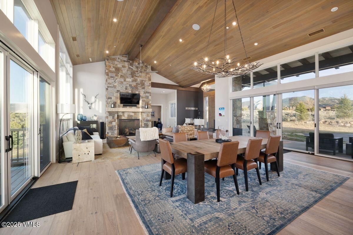 Dining room, Fireplace, Interior, Living room, Pendant Lights, Recessed Lighting, Stone Walls, Wooden Beams, Wooden Ceilings, Wood Texture Flooring