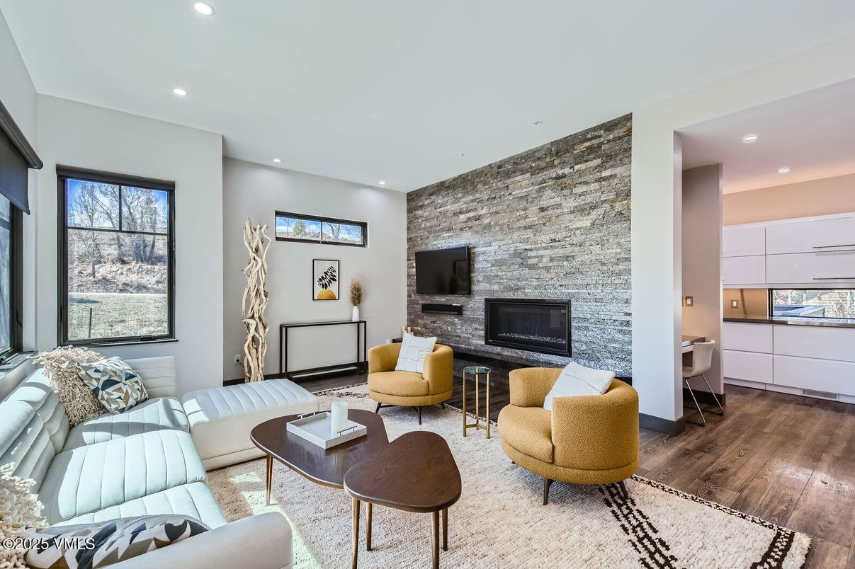 Fireplace, Interior, Living room, Recessed Lighting, Stone Walls, Wood Texture Flooring