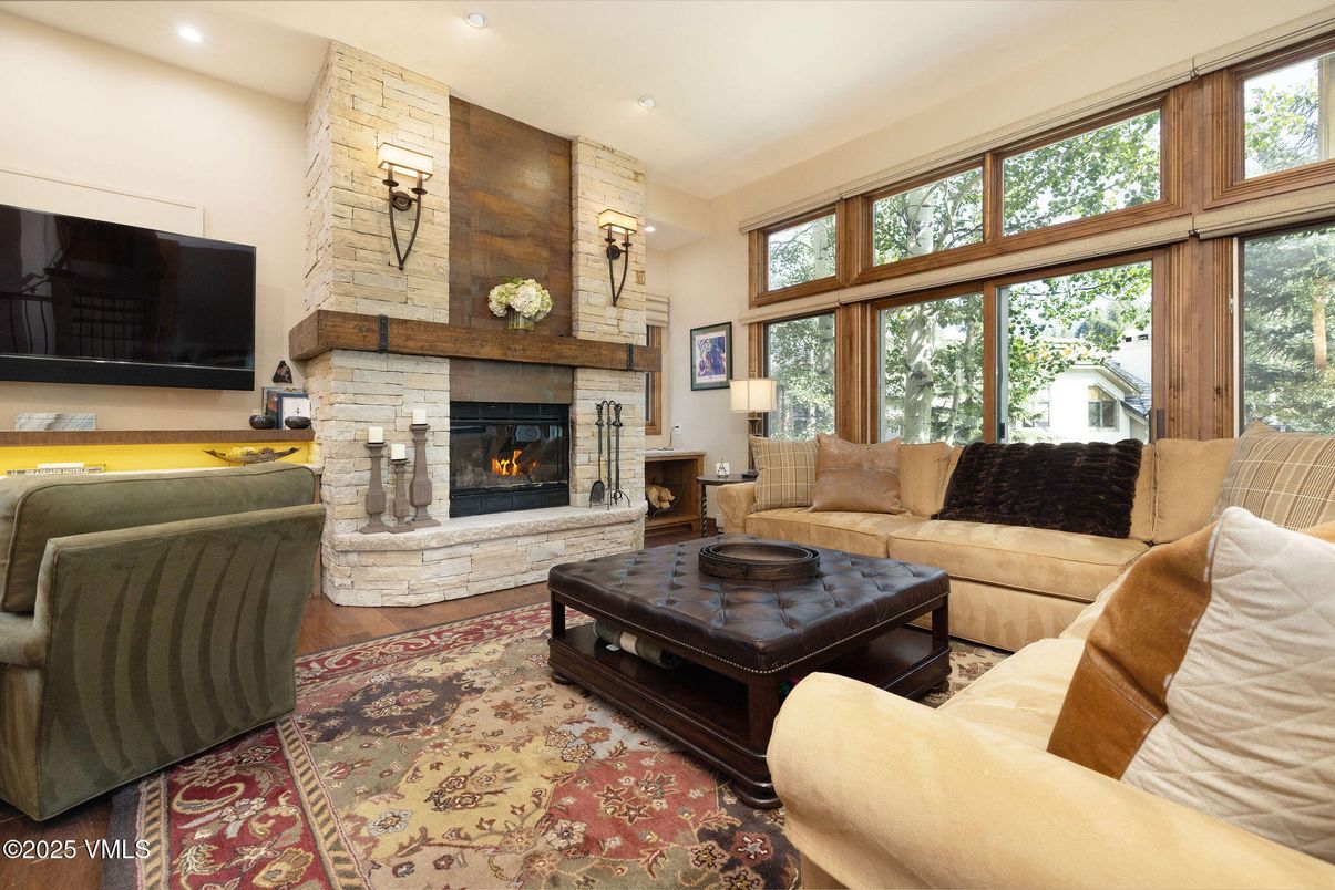 Fireplace, Interior, Living room, Recessed Lighting, Stone Walls, Wood Texture Flooring