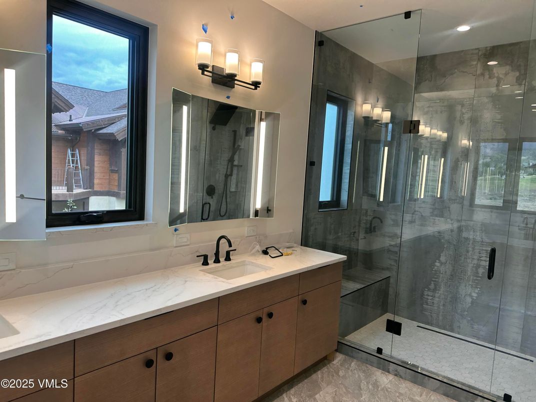 Bathroom, Dual Sink Vanities, Glass Shower, Interior, Marble Walls, Recessed Lighting