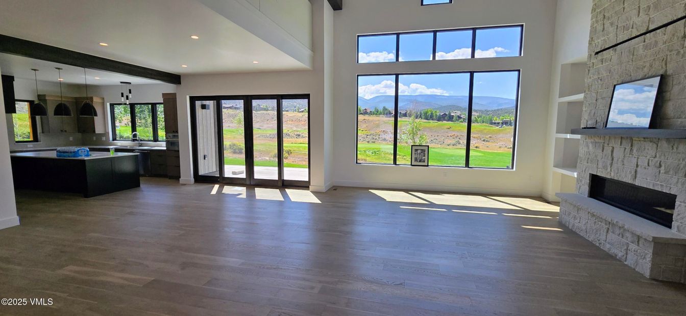 Empty room, Fireplace, Interior, Kitchen, Pendant Lights, Recessed Lighting, Wooden Beams, Wood Texture Flooring