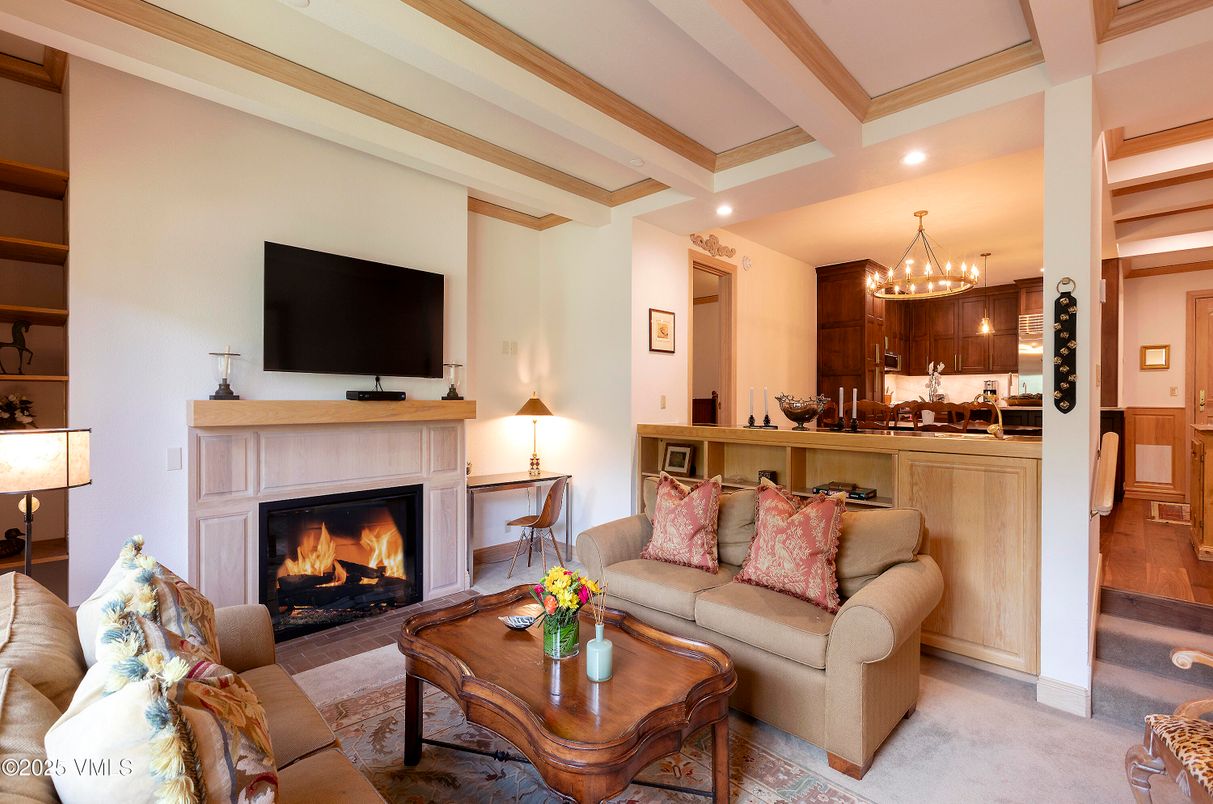 Chandelier, Fireplace, Interior, Kitchen, Living room, Recessed Lighting, Wood Texture Flooring