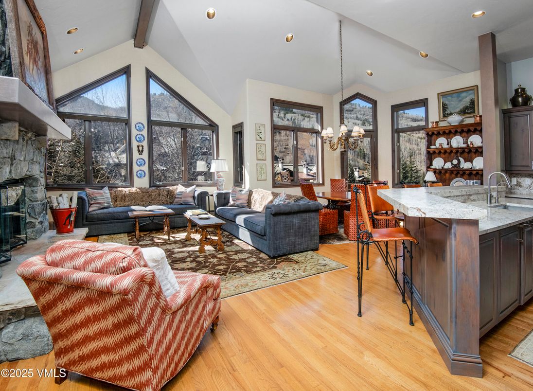 Chandelier, Dining room, Fireplace, Interior, Living room, Pendant Lights, Recessed Lighting, Wood Texture Flooring