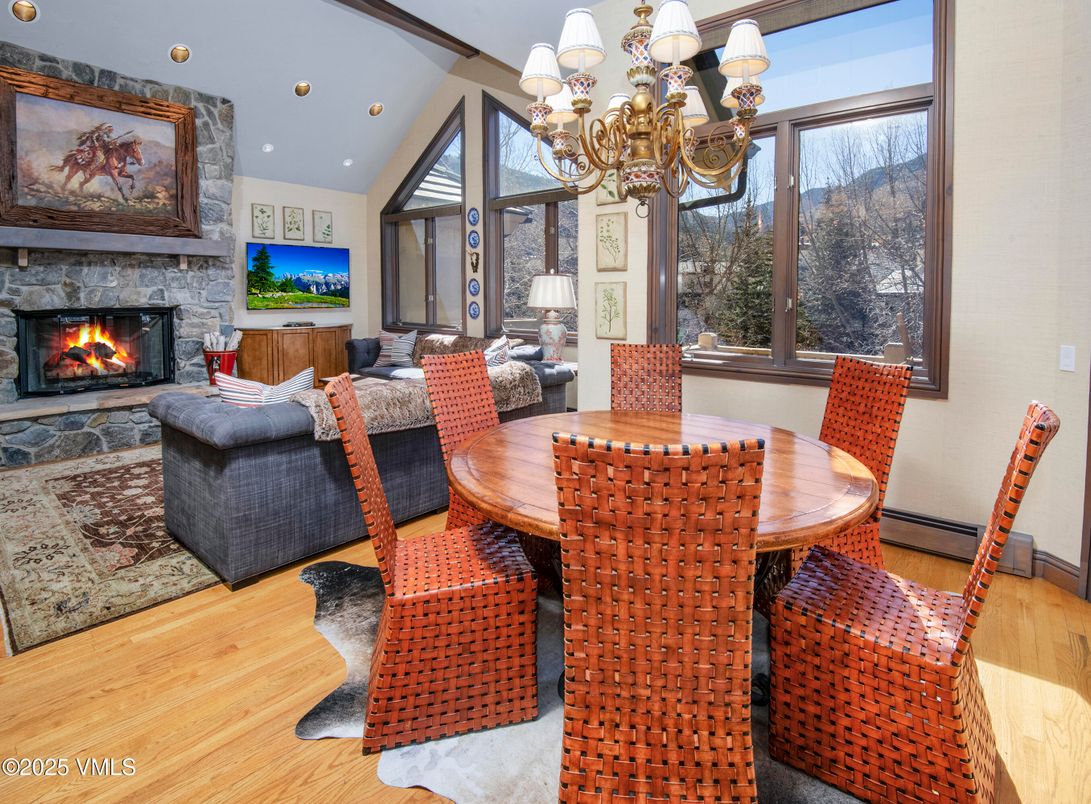 Chandelier, Dining room, Fireplace, Interior, Living room, Recessed Lighting, Wood Texture Flooring