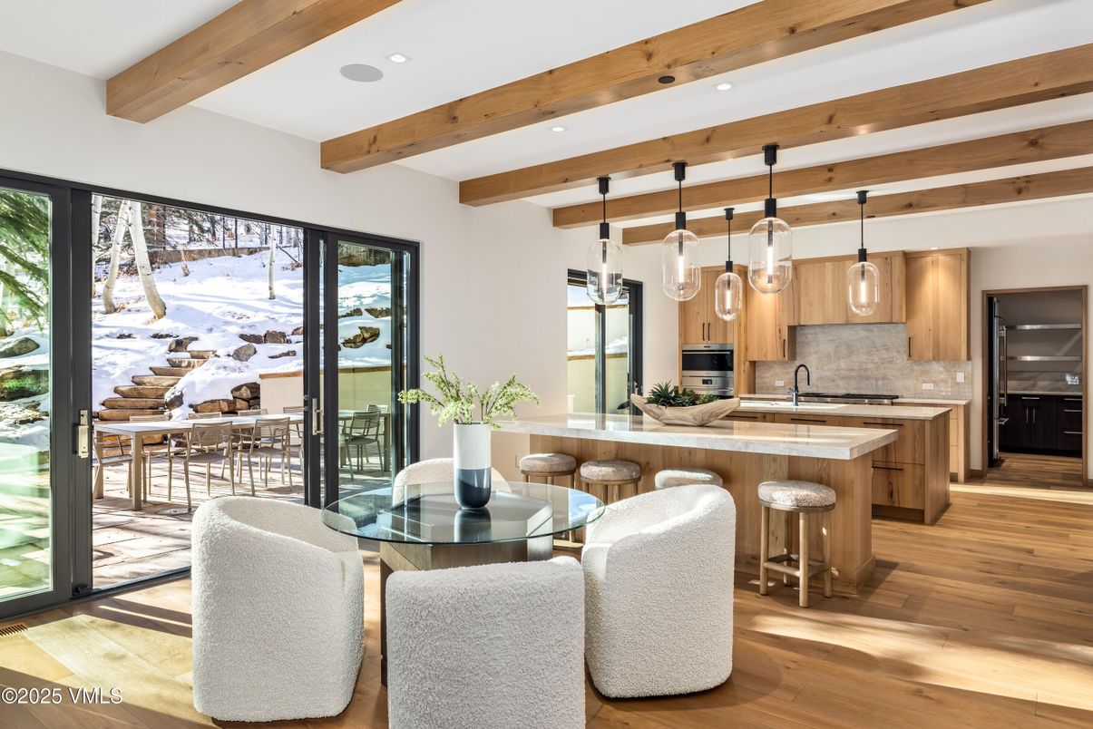 Dining room, Interior, Kitchen, Pendant Lights, Recessed Lighting, Stainless Steel Appliances, Wooden Beams, Wood Texture Flooring